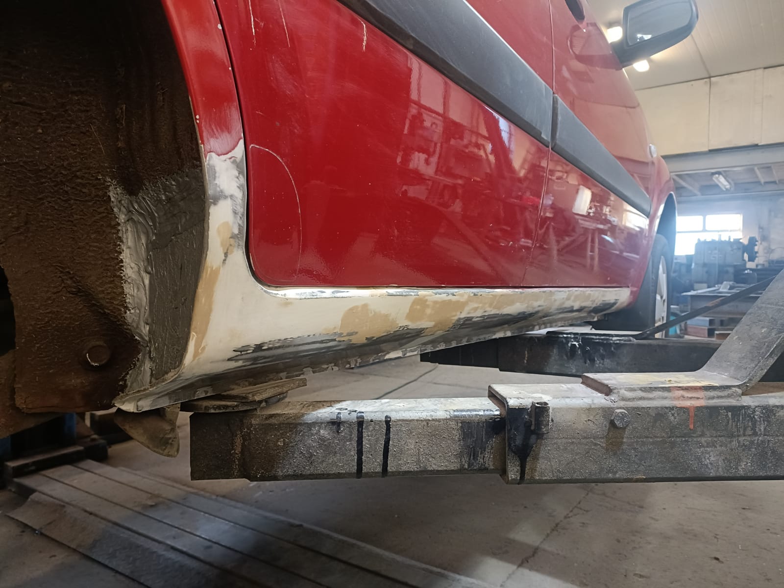 After - Major Underbody Rust Repair - Red Hatchback